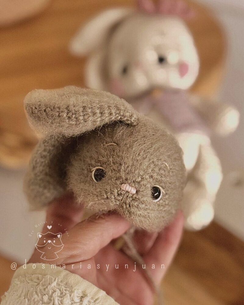 Close-up of the vintage brown bunny’s face with floppy ear – crochet details visible.