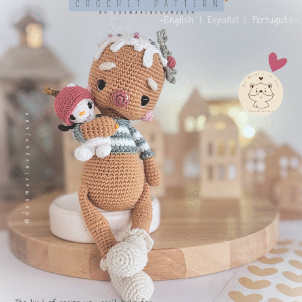 Crochet amigurumi gingerbread doll holding a tiny snowy penguin. Christmas scene in soft neutral tones.
