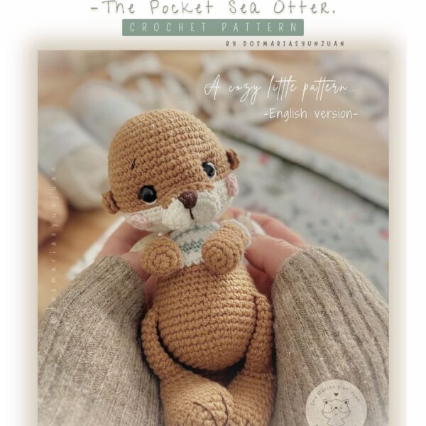 Front cover of the Botti Jr Pocket Sea Otter crochet pattern. Handmade amigurumi sea otter held between two hands, photographed in soft neutral tones. Shows the pocket-size otter with mint-striped sweater and detailed stitch texture. Digital PDF pattern by Dos Marías y un Juan.